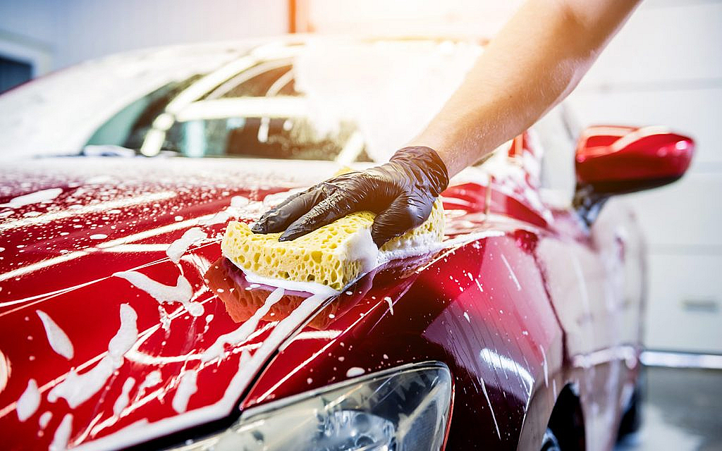 Professional vehicle cleaning at a motor dealership